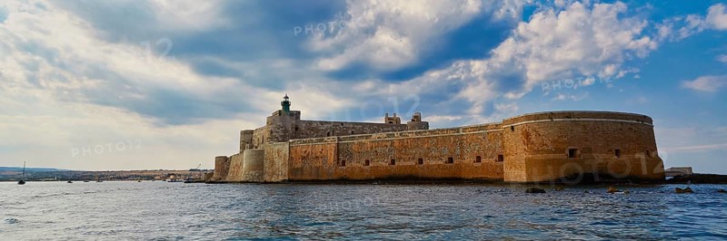 Castello Maniace, Maniace sea fortress, large Mediterranean fortress under a cloudy sky on the water, boat trip around the island of Ortigia, Isola di Ortigia, Syracuse, Sicily, Italy, Europe