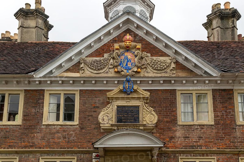 Royal Coat of Arms architectural detail, College of Matrons building, Salisbury, Wiltshire, England, UK 1682
