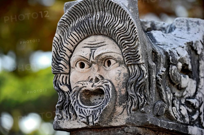Ancient stone sculpture, stone carving of a mask, Roman theatre, ancient port city of Rome, excavation site Archaeological Park Ostia Antica, metropolitan city of Rome, Lazio, Italy, Europe