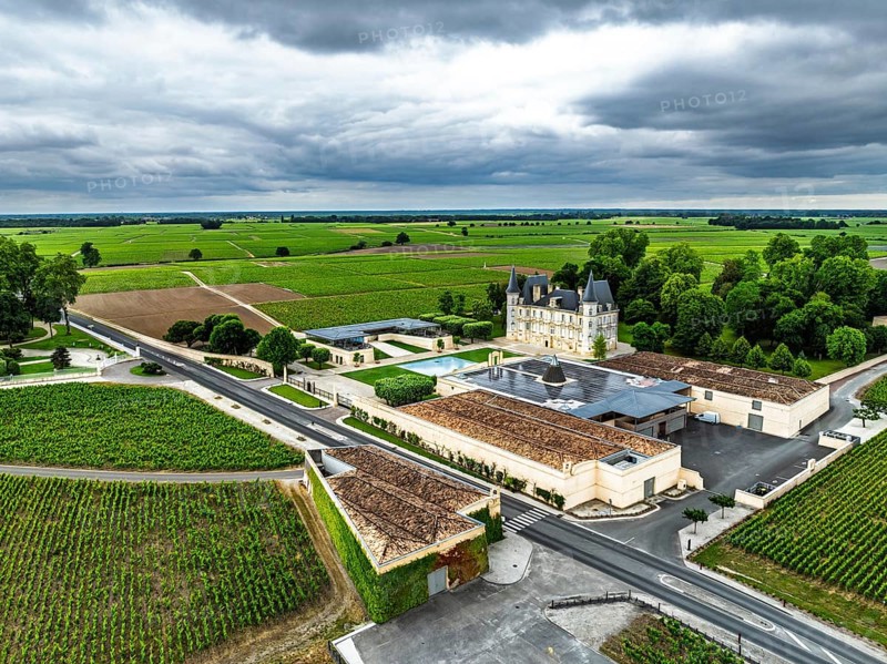 Chateau Pichon Longueville Baron Vineyard and grape fields around Pauillac from a drone, Bordeaux, Gironde, Nouvelle-Aquitaine, France, Europe