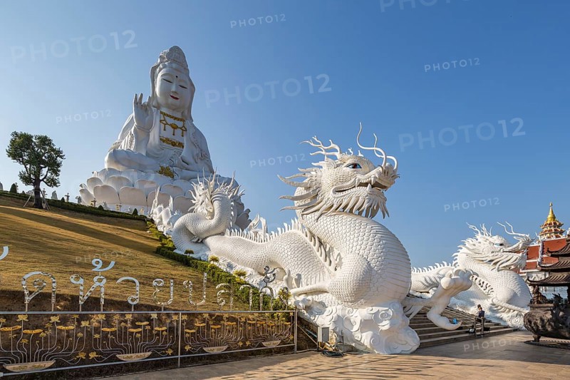 Chinese dragons line the steps up to the Guan Yin (Goddess of Mercy) statue at Wat Huay Pla Kang Temple in Chiang Rai province of Northern Thailand