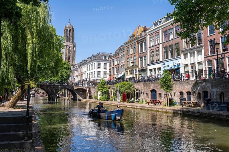 The old town centre of Utrecht, Oudegracht, around 2 km long with many old houses, cathedral tower, highest church tower in the Netherlands, newly renovated, shops, restaurants directly on the canal, many bridges, boat traffic of all kinds, canal tour, Netherlands