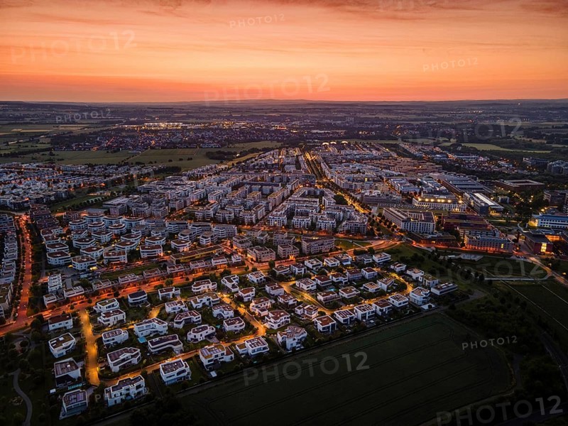 Dawn behind the Riedberg district of Frankfurt heralds the imminent sunrise. (Aerial view with a drone), Germany, Europe