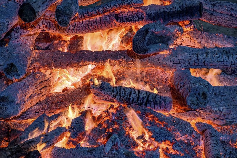 Embers burning in a bonfire during a religious festival in honor of Saint John in Brazil, Minas Gerais, Brazil, South America