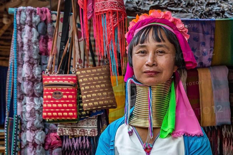 Tribal woman selling woven scarves and other crafts in the Long Neck Karen tribe (more properly called the Kayah Lahwi tribe) area of the Union of Hill Tribe Villages outside of Chiang Rai in the Nanglae District of Thailand