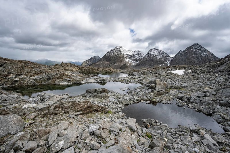 Small mountain lakes in a rocky mountain landscape, Niedere Gradenscharte, behind the summit of the Petzeck, Schober group, Hohe Tauern National Park, Carinthia, Austria, Europe