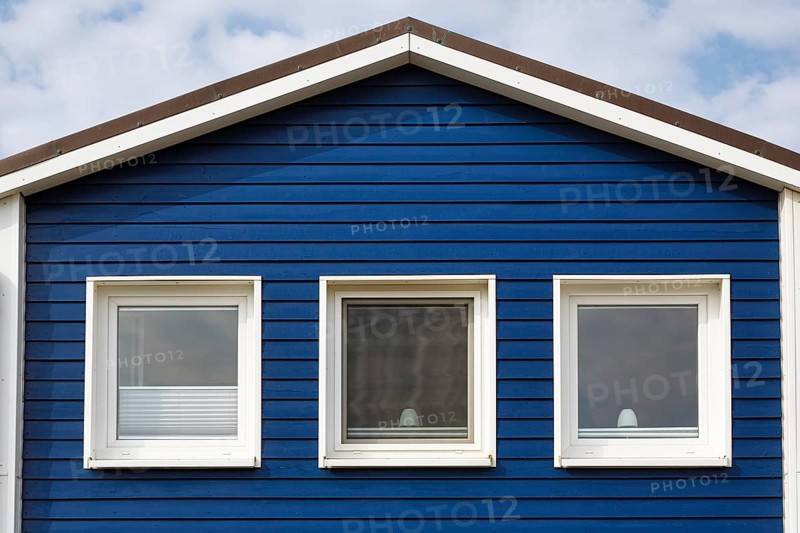 Blue lobster shack, wooden façade with three windows, façade detail in the harbour, Heligoland, Schleswig-Holstein, Germany, Europe
