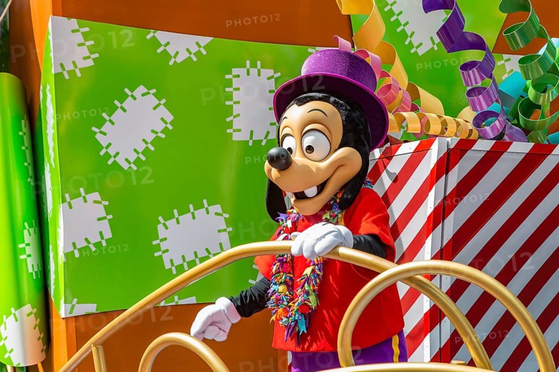 Disney character riding on float during parade through the Frontierland area of Magic Kingdom at Walt Disney World, Orlando, Florida