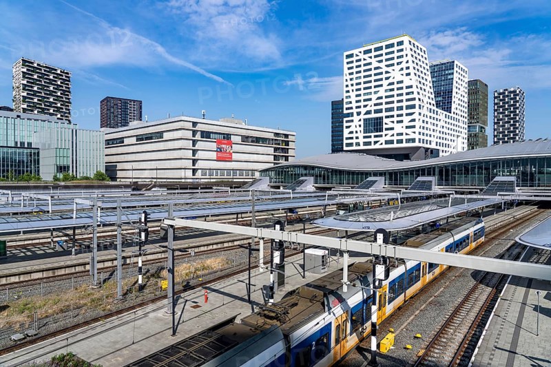 Utrecht Centraal railway station, tracks and concourse, trains of Nederlandse Spoorwegen N.V. state railway company, office building in the city centre, Netherlands