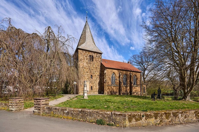 Volmerdingsen Protestant Church, Neo-Gothic architectural style, sandstone building, wall, bare winter trees, lawn, blue sky, cirrostratus clouds, Pfarrer-Brünger-Straße, Pfarrer-Dustmann-Straße, Bad Oeynhausen, Mühlenkreis Minden-Lübbecke, North Rhine-Westphalia, Germany, Europe