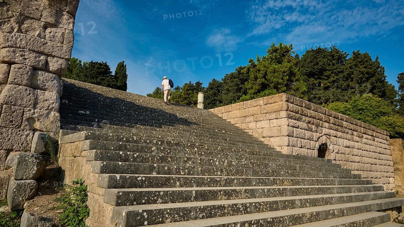 Stone staircase leads to a ruin surrounded by trees, a person climbs the steps, open staircase to the second terrace, Asklipion, Asklepieion, healing temple, temple, Hippocrates, Kos, Dodecanese, Greek Islands, Greece, Europe