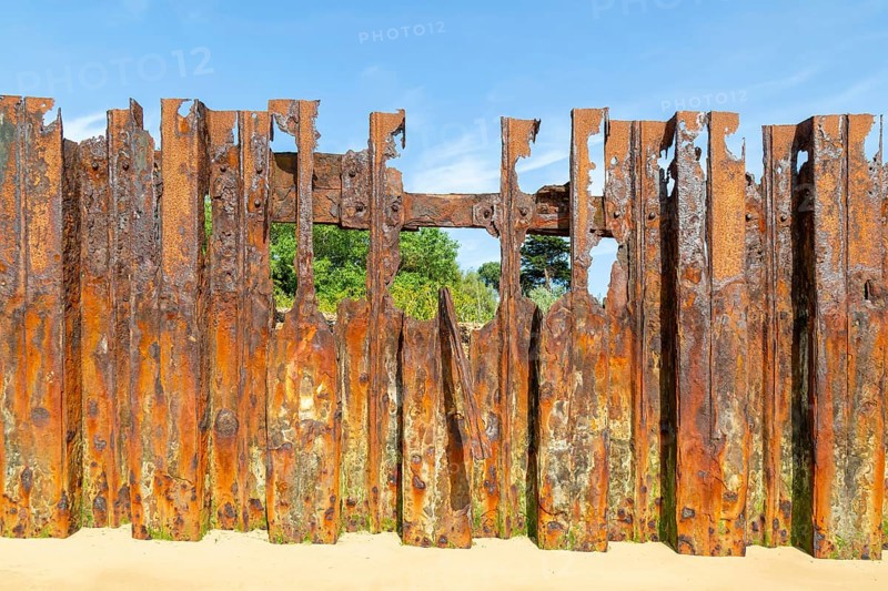 Old rusty broken steel sheet piling sea wall coastal defence, River Deben, Bawdsey, Suffolk, England, UK