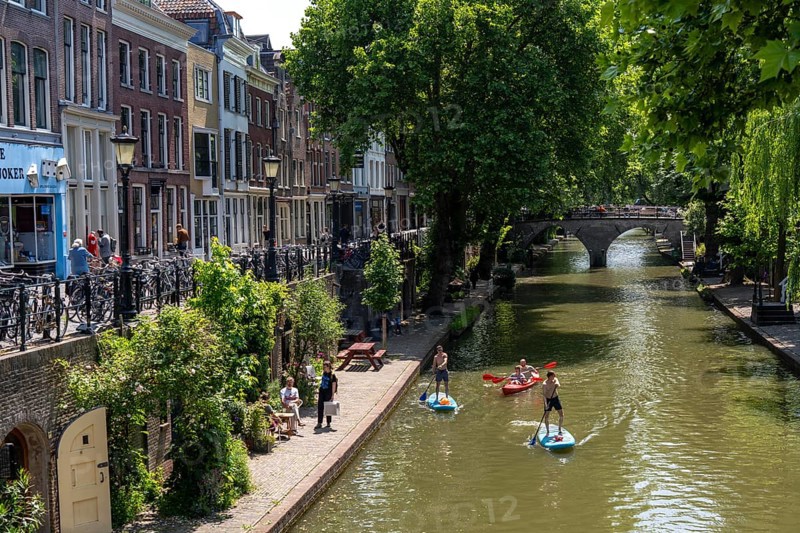 The old town centre of Utrecht, Oudegracht, around 2 km long with many old houses, shops, restaurants directly on the canal, many bridges, boat traffic of all kinds, Netherlands