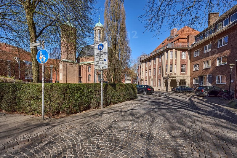 Clemenskirche, church, Baroque architectural style, architect Johann Conrad Schlaun, general architecture, cobblestone street, bare winter trees, hedge, pedestrian zone, traffic sign, blue cloudless sky, intersection An der Clemenskirche with Loerstraße, Münster, Münsterland, independent city, North Rhine-Westphalia, Germany, Europe