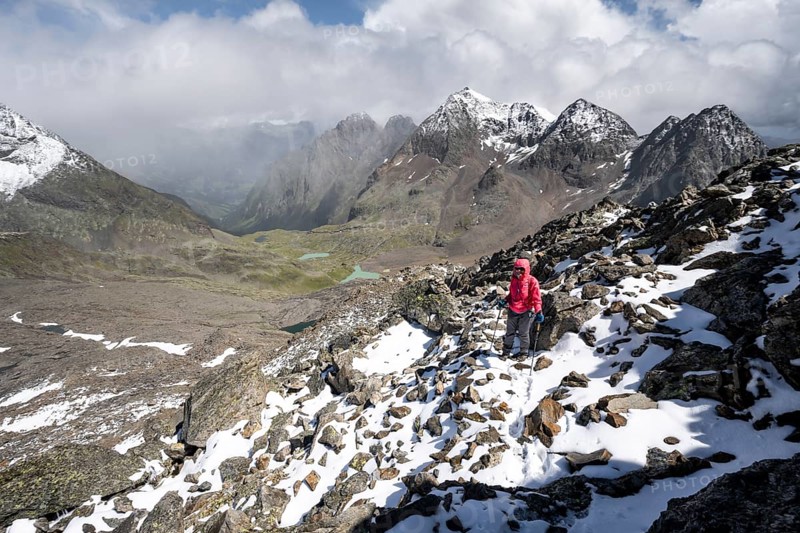 Mountaineers in a rocky mountain landscape, ascent to the Keeskopf from the Niedere Gradenscharte, behind the summit of the Petzeck, Hoher Perschitzkopf and Kruckelkopf, Schober group, Hohe Tauern National Park, Carinthia, Austria, Europe