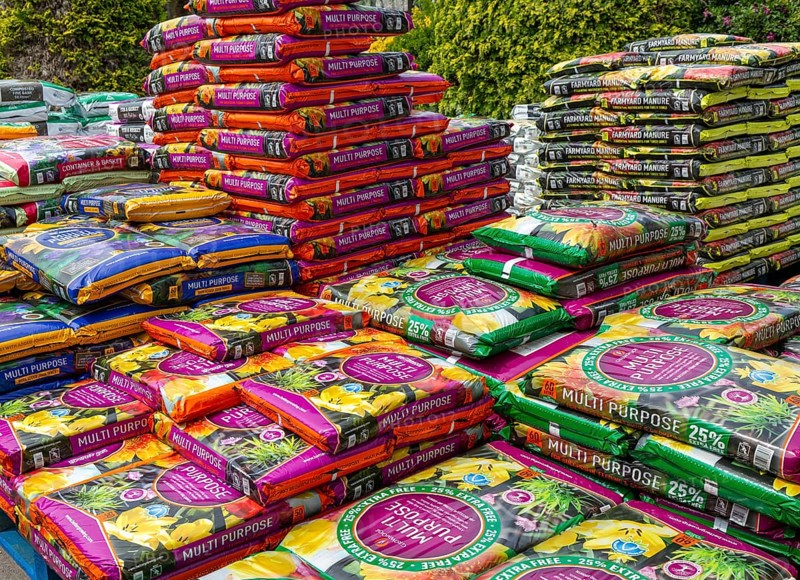Multi Purpose compost bags stacked up at Lowden garden centre, Wiltshire, England, UK