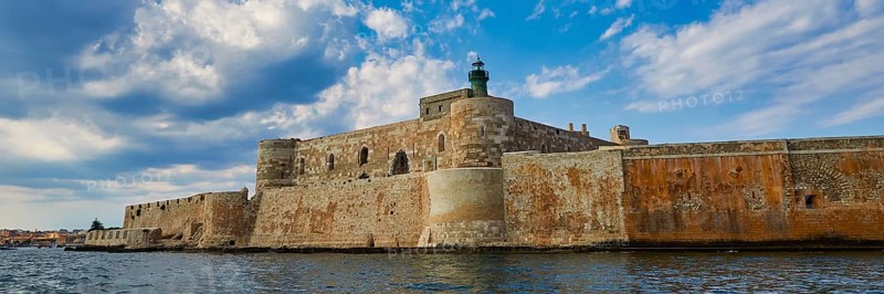Castello Maniace, sea fortress Maniace, ancient fortress with lighthouse in front of a cloudy sky, boat trip around the island of Ortigia, Isola di Ortigia, Syracuse, Sicily, Italy, Europe