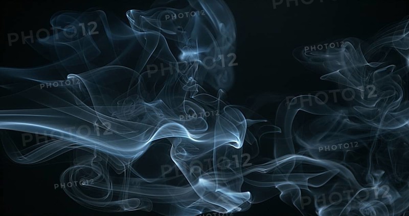 Smoke of Cigarette rising against Black Background