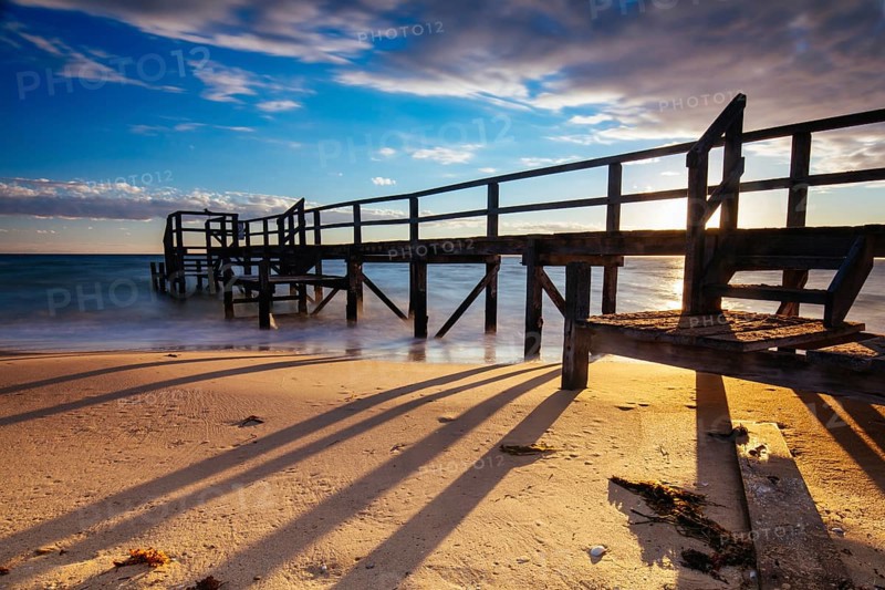 Piers near Millionaire's Walk at Point King Beach on a cool winter's morning at sunrise on the Mornington Peninsula in Sorrento, Victoria, Australia, Oceania