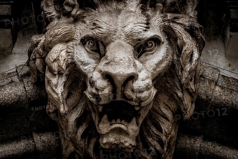 Italy, Turin. Made of stone and located on a marble arch, aroud 300 years old. Fallen angel in the shape of a roaring lion, Europe