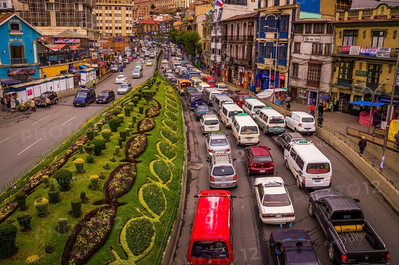 View from a bridge showing a street full of cars stuck in a traffic jam on the city highway in rush hour, La Paz, BOLIVIA in October 2015