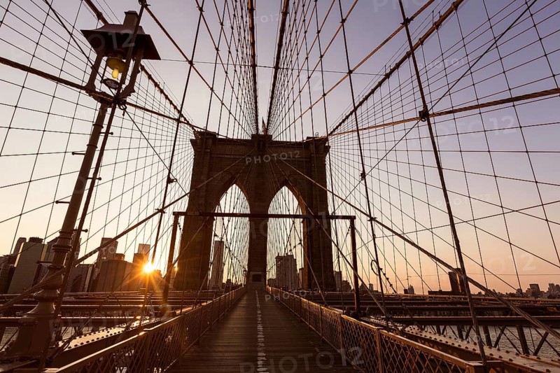 Brooklyn Bridge sunset with Manhattan skyline of New York City USA