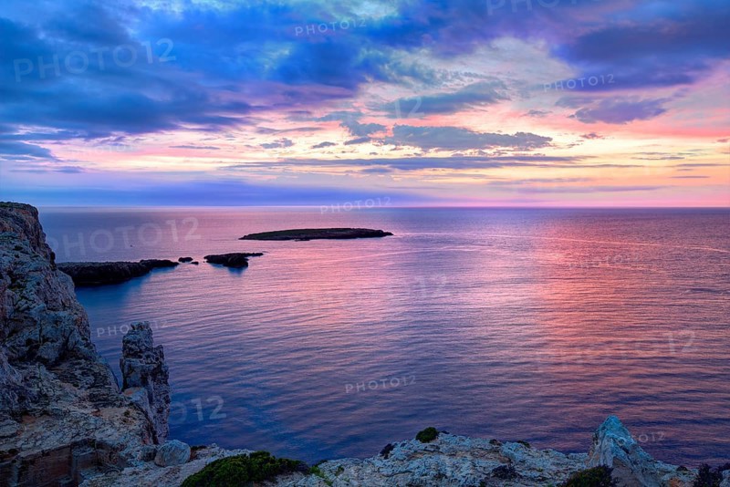 Menorca sunset in Cap de Caballeria cape at Balearic Islands es Mercadal