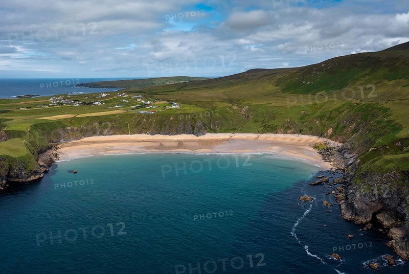 A drone aerial view of the beautiful Silver Strand and horseshoe bay at Malin Beg on the Wild Atlantic Way of Ireland