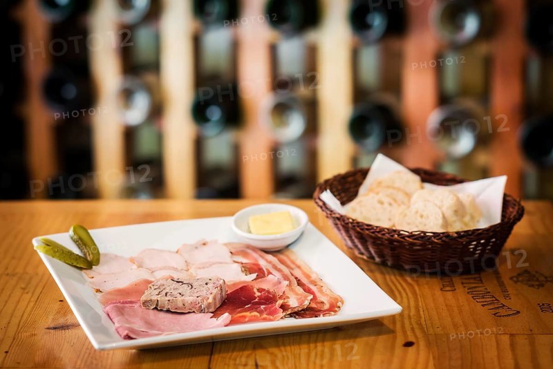 Traditional french charcuterie and pate starter platter with bread
