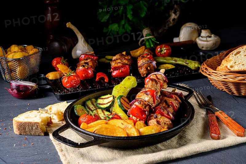 Shish kebab with various vegetables and spices Country potatoes