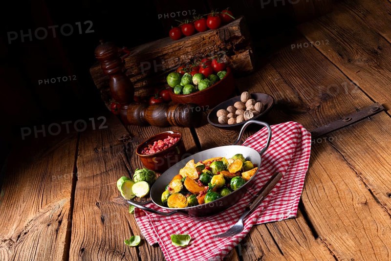 Brussels sprouts potato pan with bacon in a rustic style
