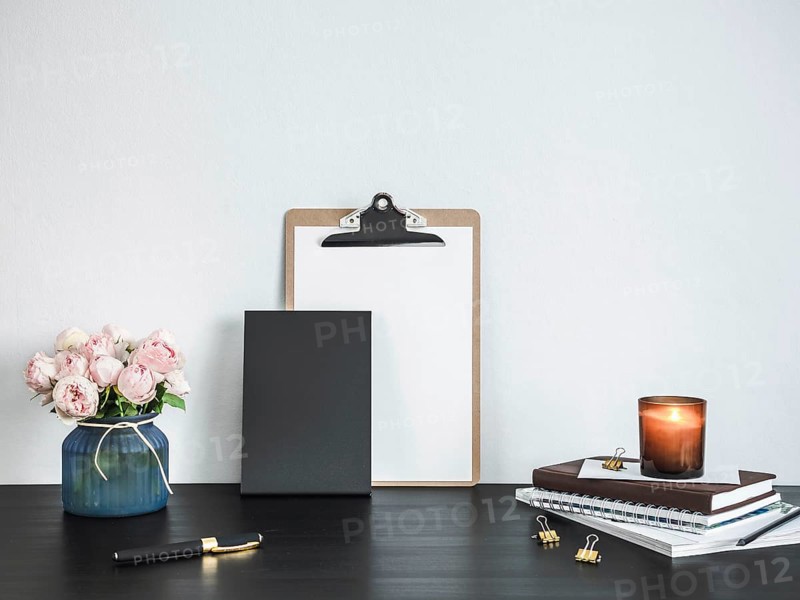 Empty chalkboard on table. Home office concept or mockup. Chalkboard mock up portrait format, copy space for text