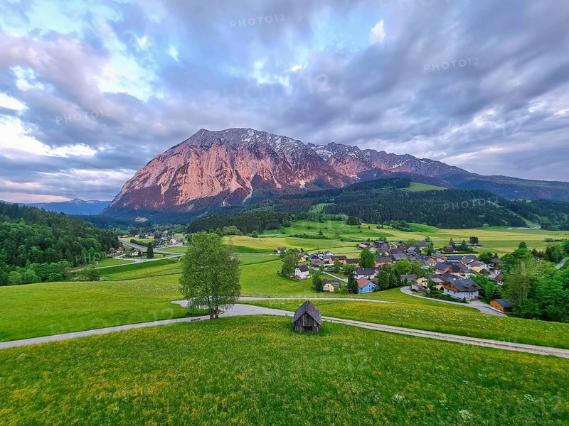 Summer austrian landscape with Grimming mountain (2.351 m), an isolated peak in the Dachstein Mountains, view from small alpine village Tauplitz, Styria, Austria, Europe