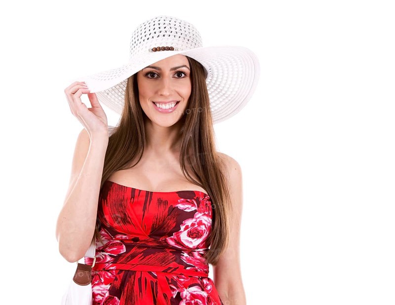 Young woman wearing red dress on white background, Toronto, Canada, North America