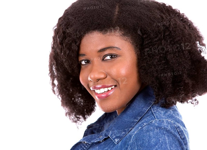 Beautiful young black woman is wearing jean dress on white background, Toronto, Canada, North America