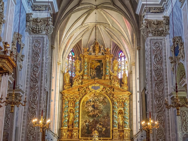 Gold-decorated altar in the Baroque church interior with ornate paintings and decorative details on the walls, Dürnstein, Wachau, Danube, Austria, Europe