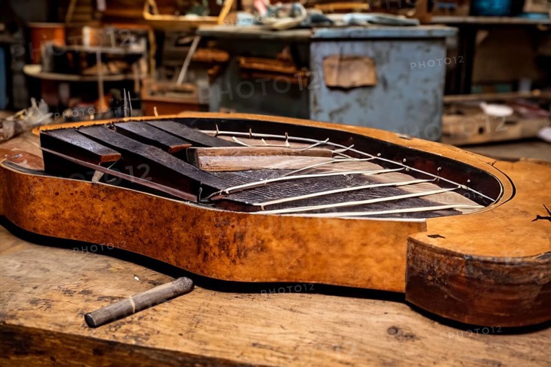 Interior of an old musical workshop with musical instruments and tools