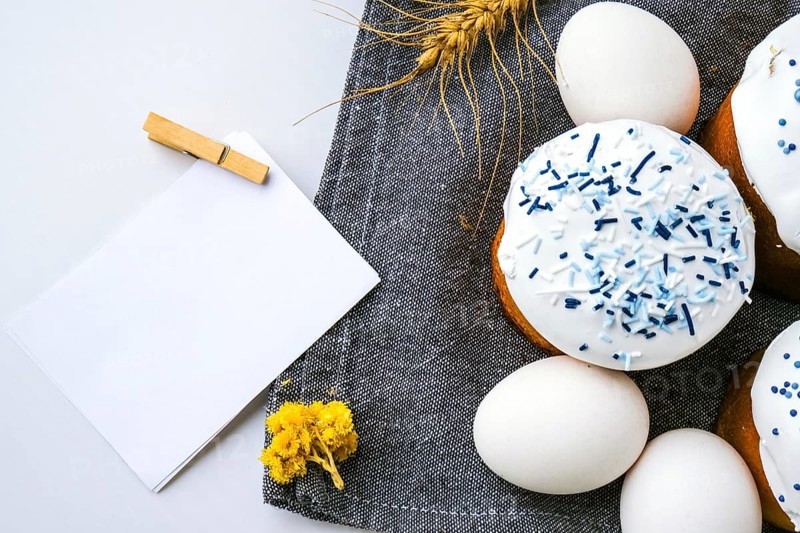 Happy Day Bright Easter. Orthodox Easter holiday. Traditional food. Creative stylish trend Homemade easter cake and eggs. Copy space sheet paper. Kulich Festive easter background Minimalism
