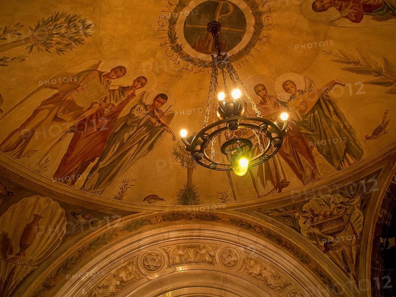 Ceiling frescoes with religious motifs and ornate details as well as lighting, montserrat, spain