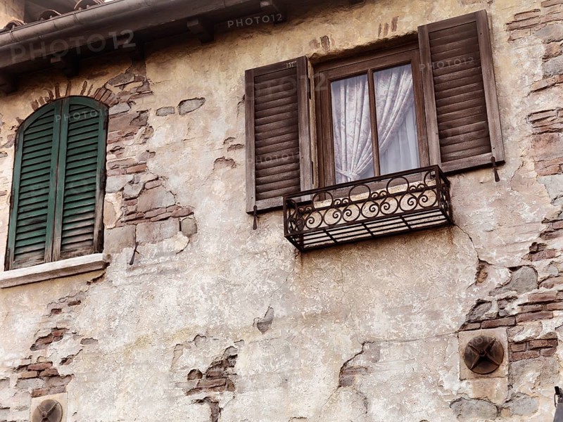 Old rustic house windows, antique architecture in Venetian style