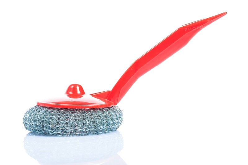 Scrub brush with red handle isolated