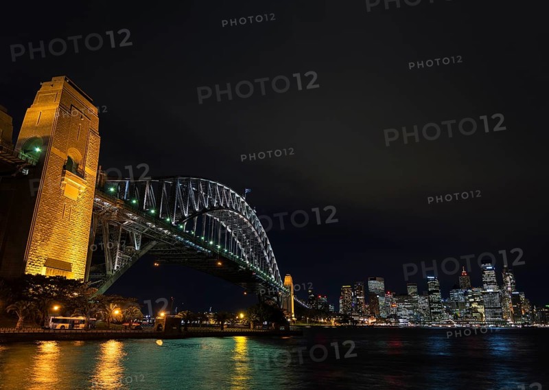 Famous sydney harbour bridge and CBD skyline landmarks in australia at night