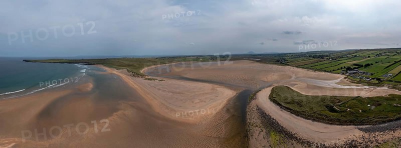 A panorama drone landscape view of the beautiful golden sand beach at Lacken Strand on the coast of North Mayo in Ireland