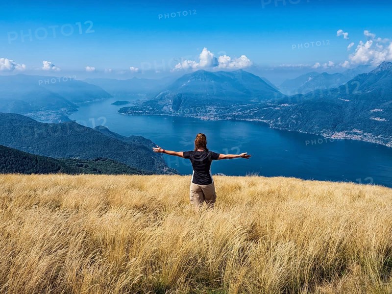Woman walking in a prairie on Lake Como alps