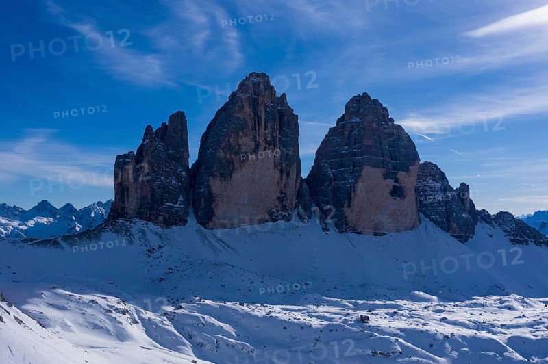 Tre Cime Di Lavaredo. The Three Peaks on Sunny Day in Winter. Aerial View. Sexten Dolomites, South Tyrol. Italy. View from the North