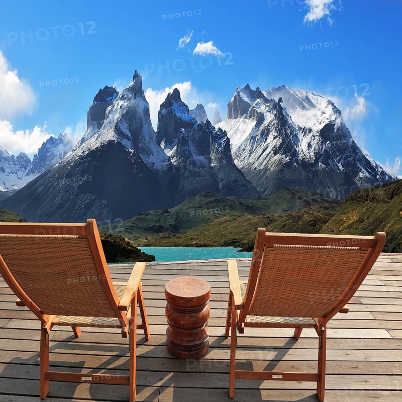 Comfortable wooden chair - chaise lounges stand on a wooden platform. Lookout is arranged in front of the famous cliffs of Los Kuernos. National Park Torres del Paine, Patagonia, Chile. Collage
