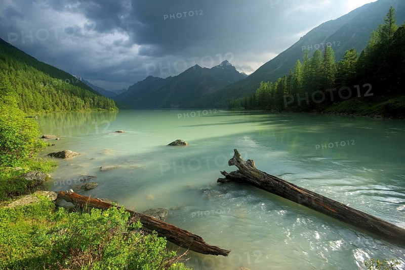 Beautiful mountain landscape near the lake. Mountain Lake. Kind of mountainous terrain and the water in the valley
