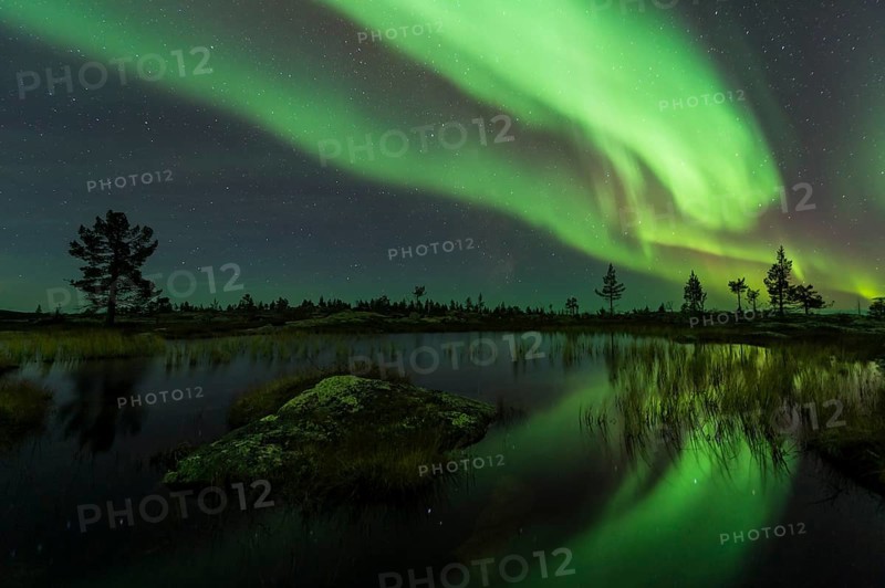 Northern Lights (Aurora borealis) reflected in a mountain lake, Gällivare, Norrbotten, Lapland, Sweden, October 2013, Europe