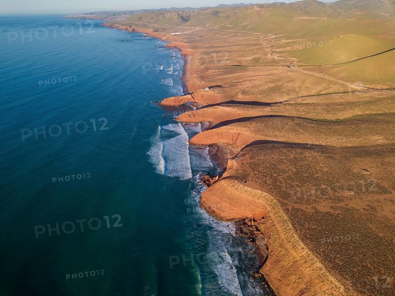 Aerial view on Legzira beach with arched rocks on the Atlantic coast at sunset in Morocco