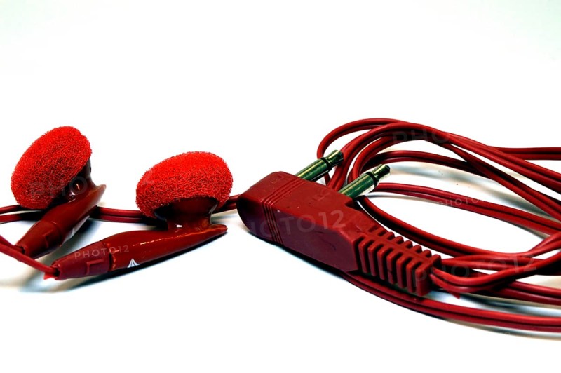 Earphones of red color for portable devices